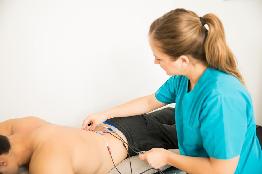 female physical therapist positioning